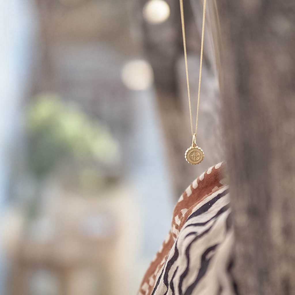 Bianca Jones compass baby necklace available in sterling silver or gold vermeil, symbolising guidance and adventure for explorers.