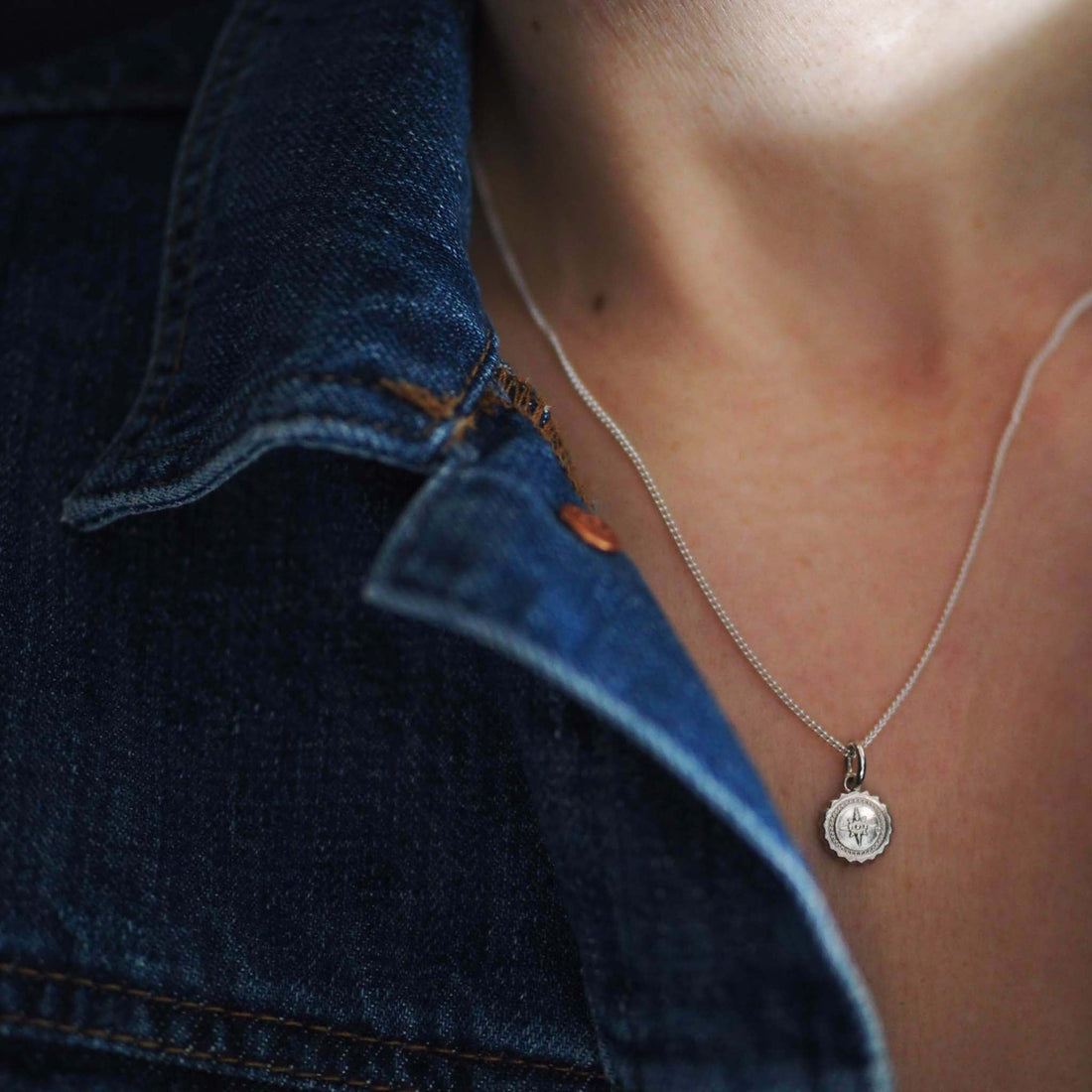 Bianca Jones compass baby necklace available in sterling silver or gold vermeil, symbolising guidance and adventure for explorers.
