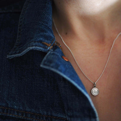 Bianca Jones compass baby necklace available in sterling silver or gold vermeil, symbolising guidance and adventure for explorers.