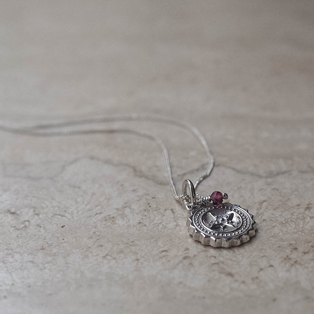 Compass Midi Necklace with Garnet: A symbol of guidance and adventure, perfect for encouraging loved ones on their journeys.