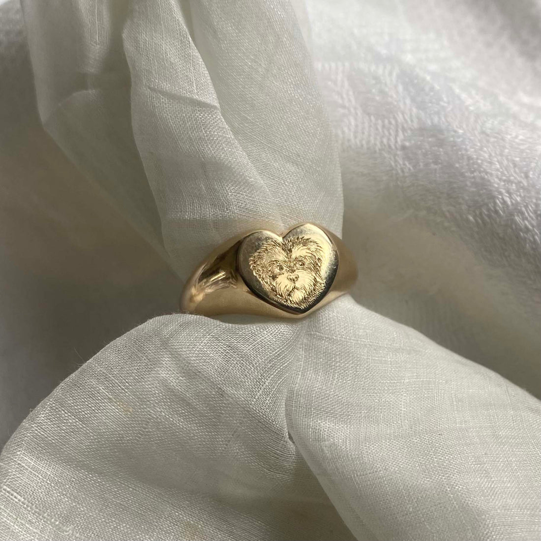 Pet Portrait Signet Ring in solid gold, hand-engraved with a detailed portrait of your beloved pet, symbolising timeless love and cherished memories.