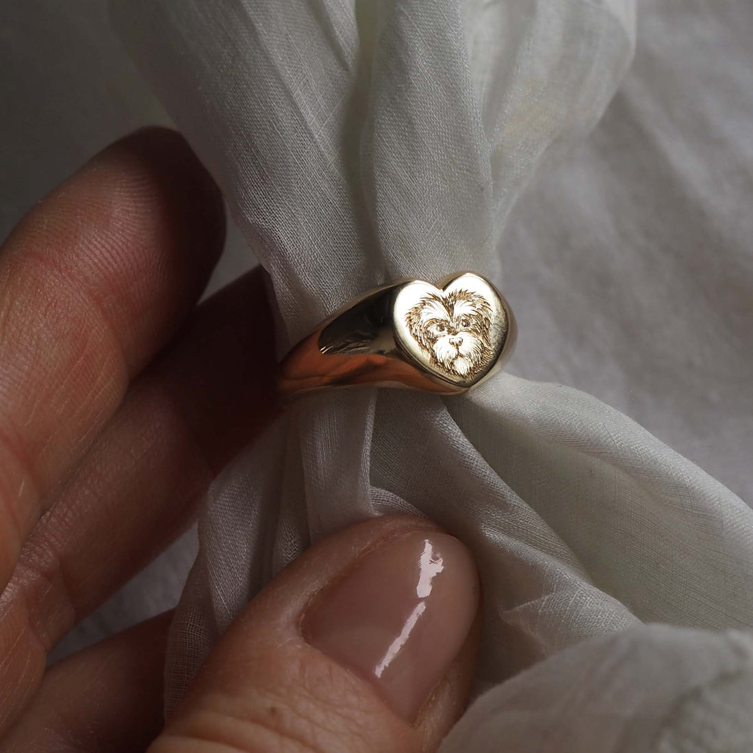 Pet Portrait Signet Ring in solid gold, hand-engraved with a detailed portrait of your beloved pet, symbolising timeless love and cherished memories.