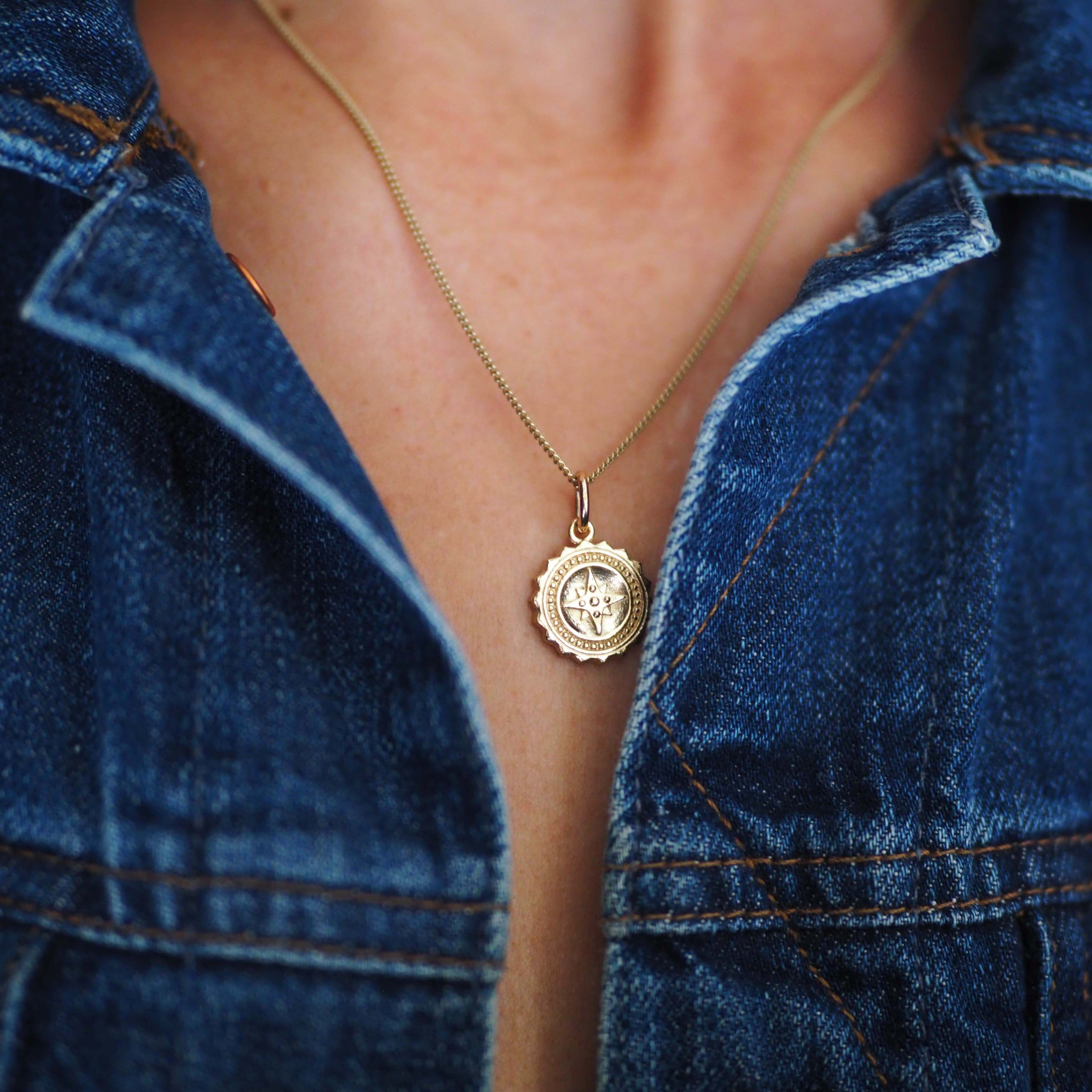 Compass Necklace in 9ct gold, symbolising guidance and protection. A timeless piece that captures the spirit of adventure, perfect for those embarking on new journeys.