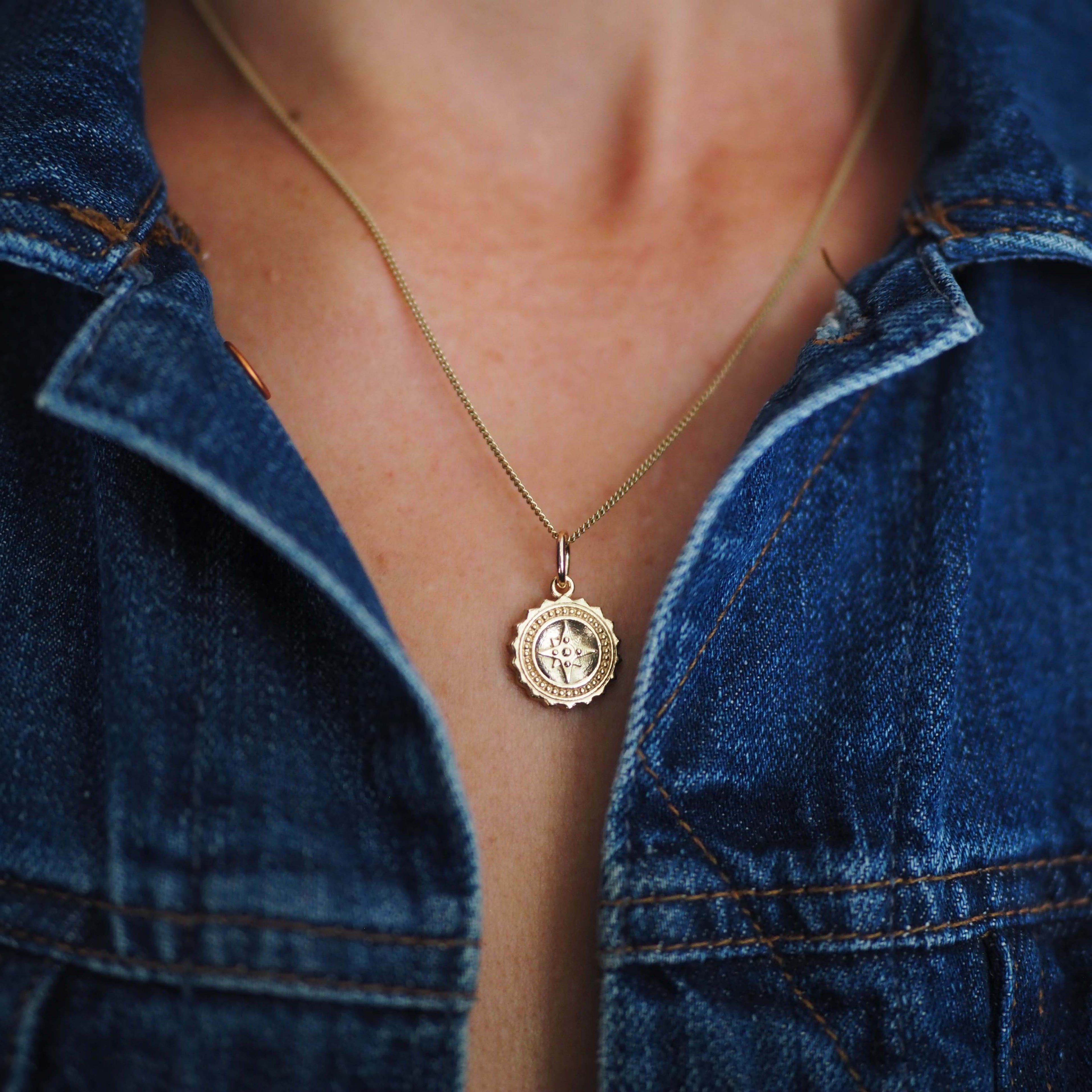 Compass Necklace in 9ct gold, symbolising guidance and protection. A timeless piece that captures the spirit of adventure, perfect for those embarking on new journeys.