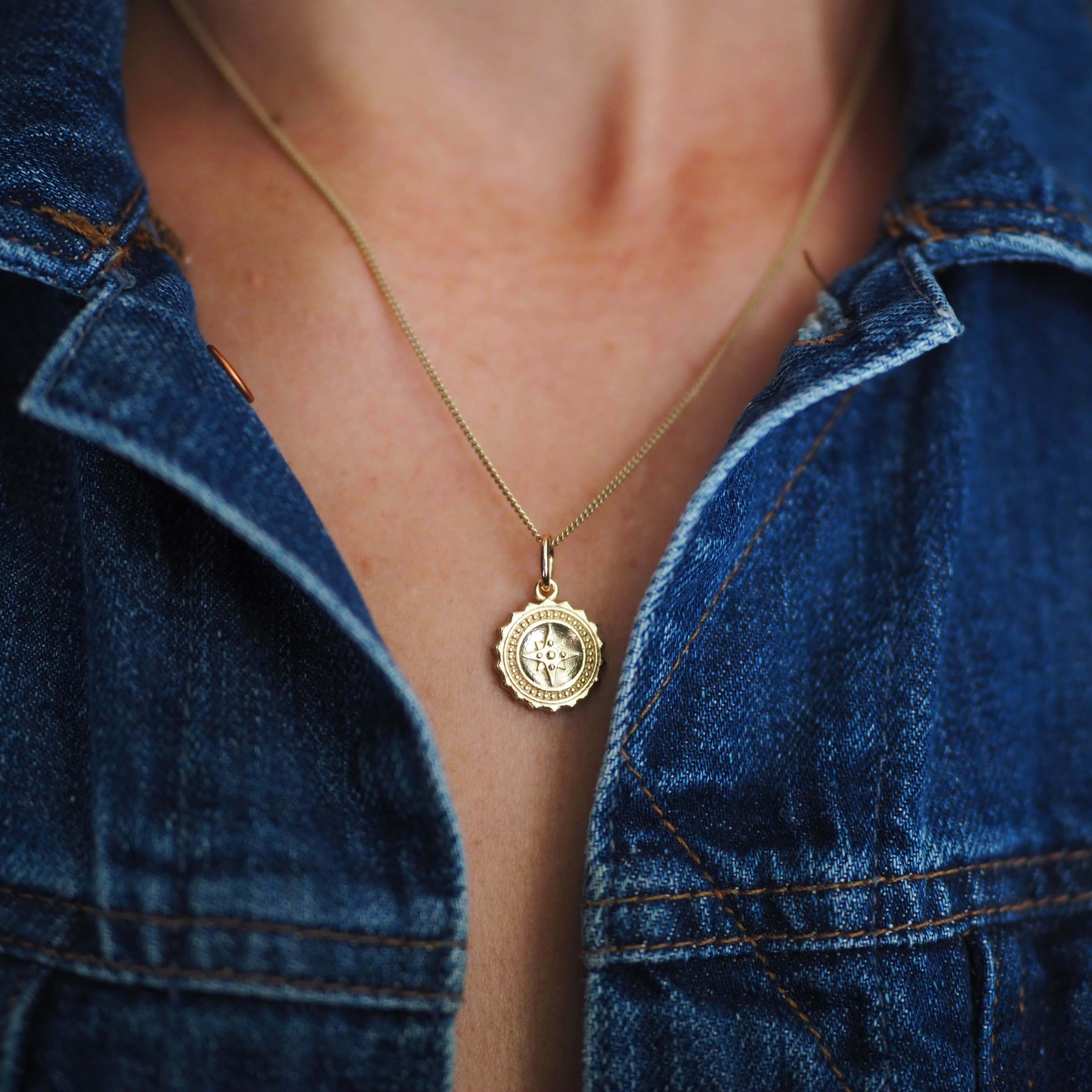 Compass Necklace in 9ct gold, symbolising guidance and protection. A timeless piece that captures the spirit of adventure, perfect for those embarking on new journeys.