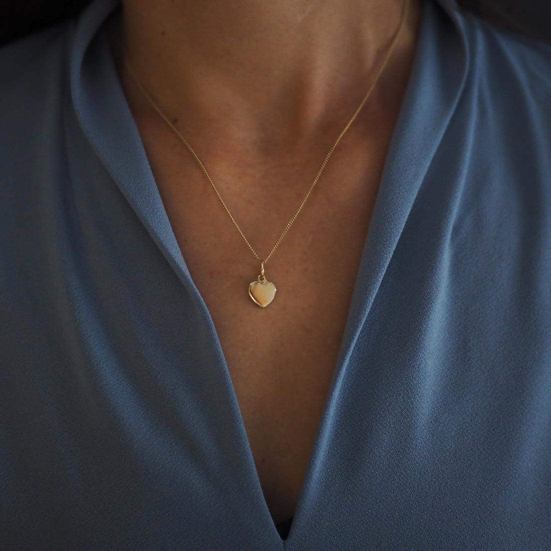 Solid Gold Love Heart Necklace, handcrafted in a classic heart shape. Perfect for personalisation with initials or dates, symbolising timeless love and connection.