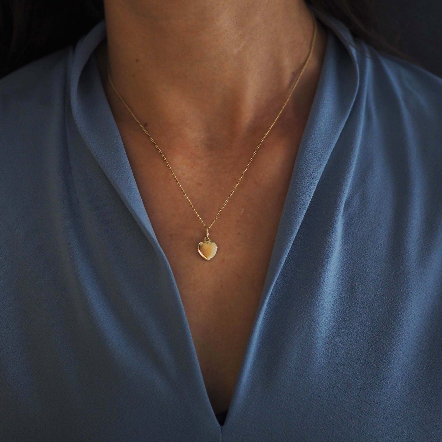 Solid Gold Love Heart Necklace, handcrafted in a classic heart shape. Perfect for personalisation with initials or dates, symbolising timeless love and connection.