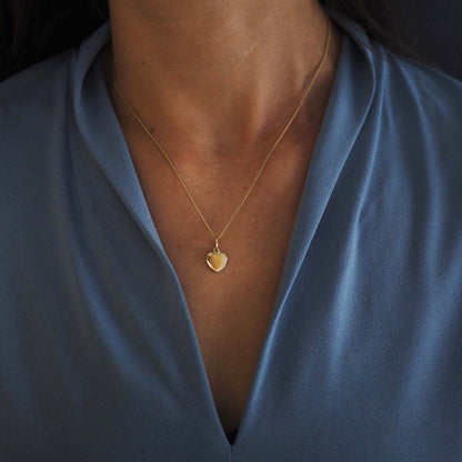 Solid Gold Love Heart Necklace, handcrafted in a classic heart shape. Perfect for personalisation with initials or dates, symbolising timeless love and connection.