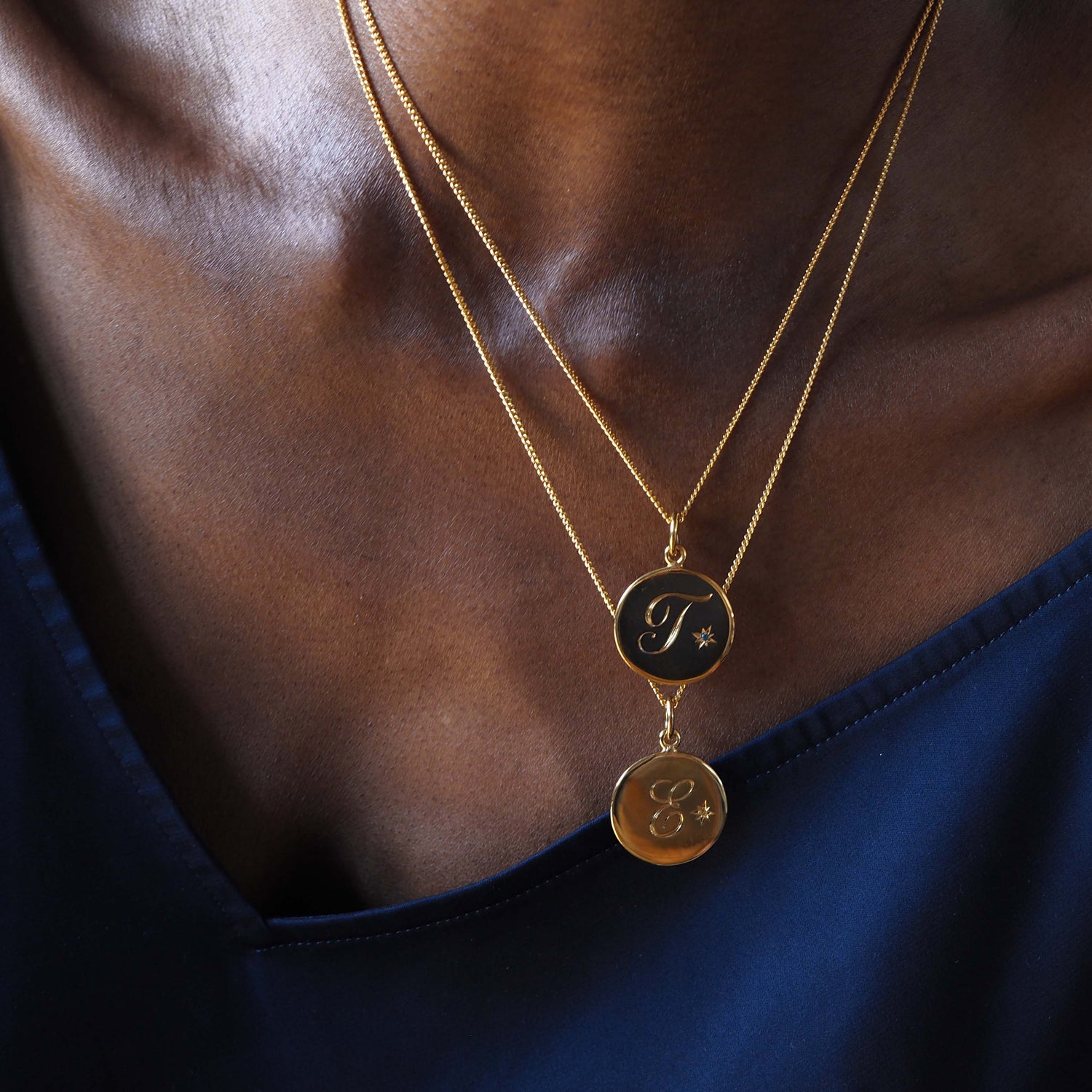 Solid 18ct Gold Vermeil Birthstone May Emerald Initial Necklace with a hand-engraved scrolled initial and brilliant-cut Emerald in a Victoriana star-style setting. Ideal for May birthdays, symbolising wisdom, growth, and protection.