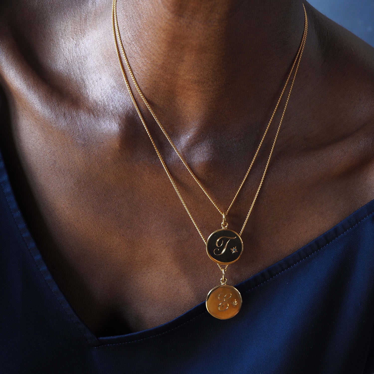 Solid 18ct Gold Vermeil Birthstone May Emerald Initial Necklace with a hand-engraved scrolled initial and brilliant-cut Emerald in a Victoriana star-style setting. Ideal for May birthdays, symbolising wisdom, growth, and protection.