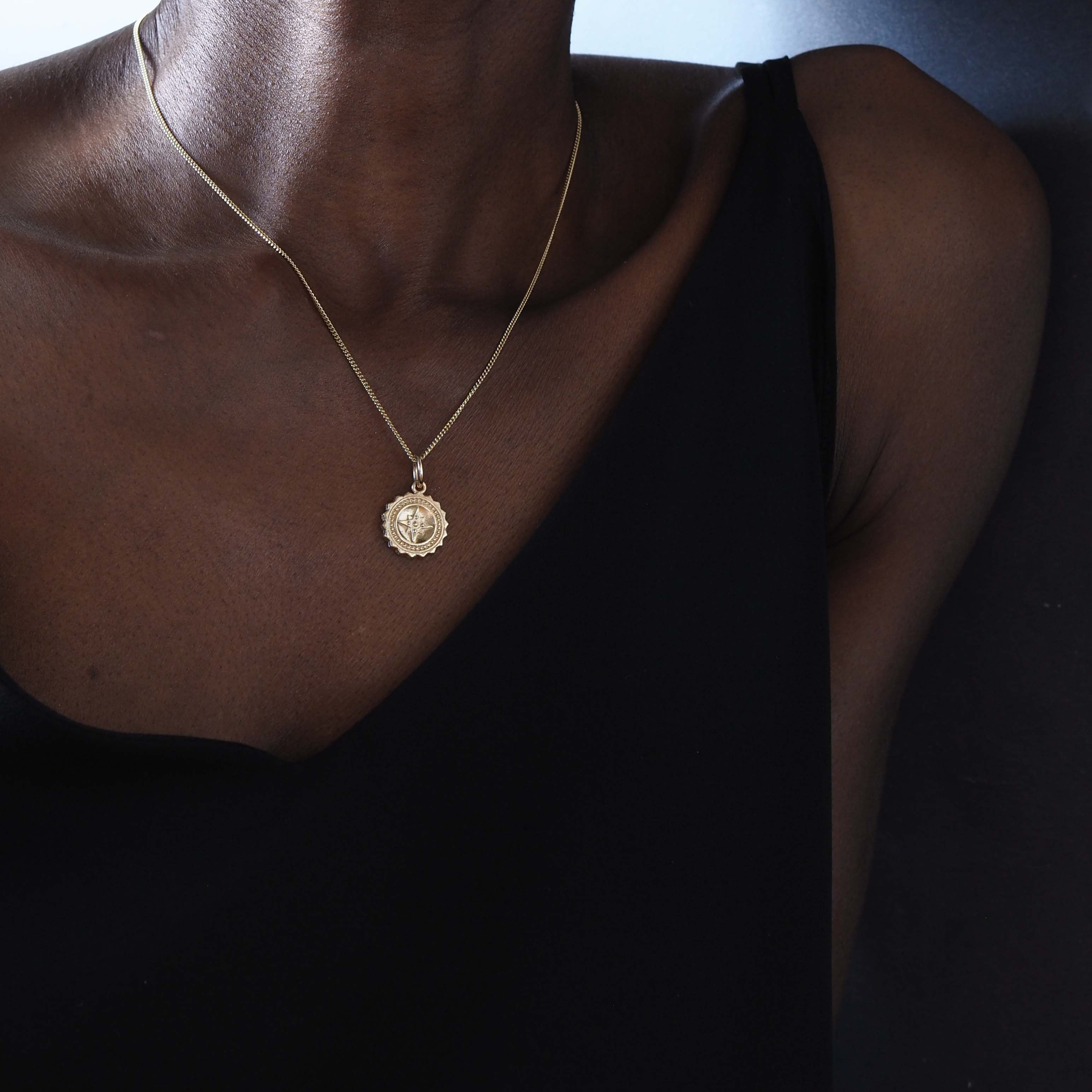 Compass Necklace in 9ct gold, symbolising guidance and protection. A timeless piece that captures the spirit of adventure, perfect for those embarking on new journeys.