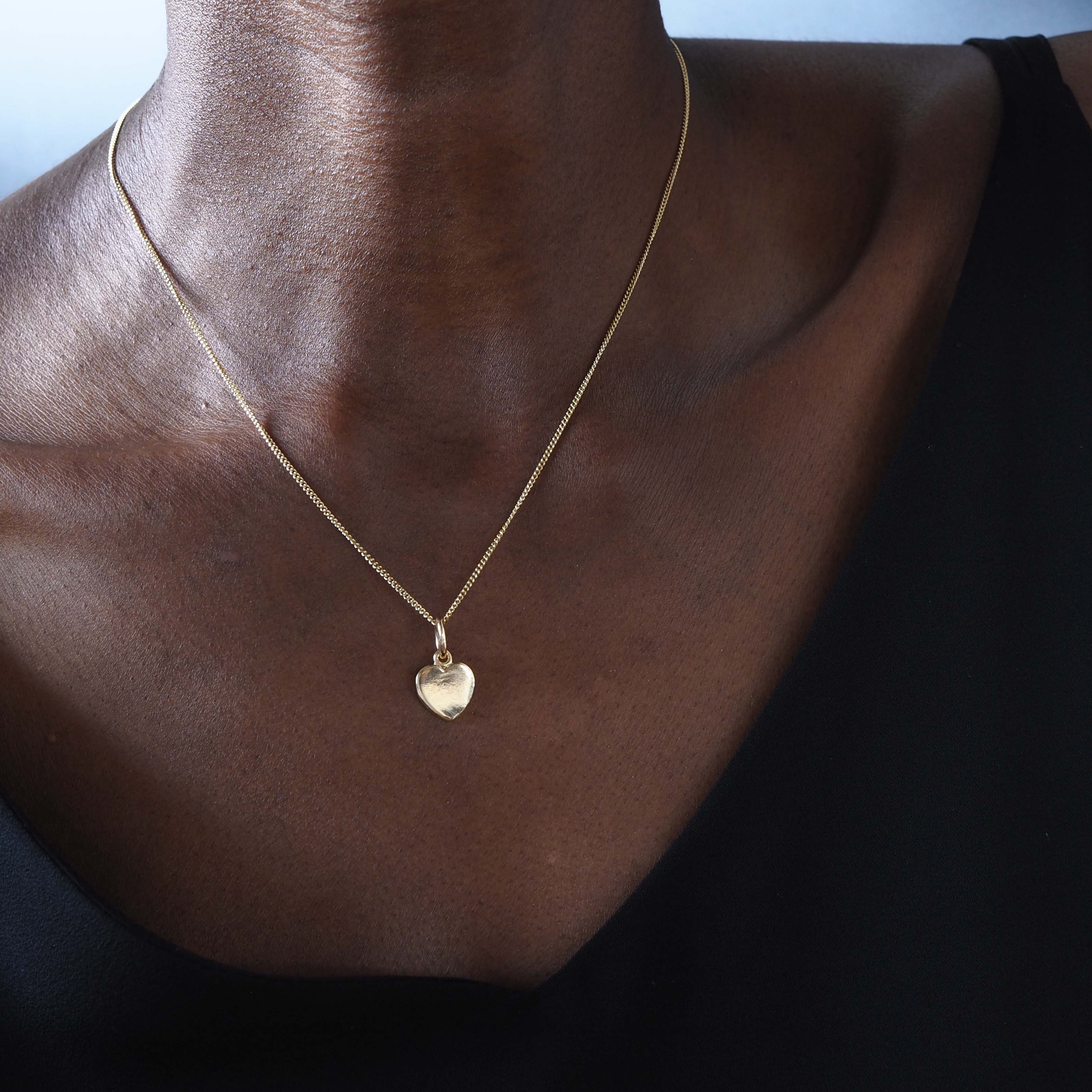 Solid Gold Love Heart Necklace, handcrafted in a classic heart shape. Perfect for personalisation with initials or dates, symbolising timeless love and connection.