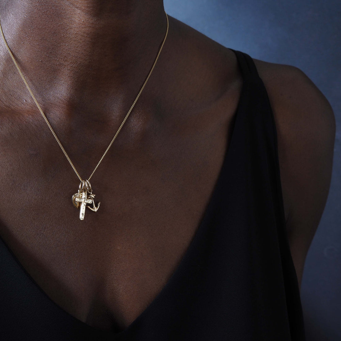 Faith, Hope, and Charity Necklace in solid 9ct gold, showcasing a heart, anchor, and cross charm. Available in Yellow, White, or Rose Gold, symbolising love, hope, and protection.