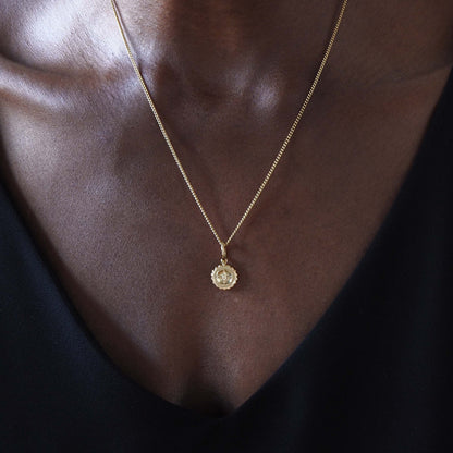 Solid 18ct gold Compass Mini Necklace, featuring a delicate charm that symbolises guidance and strength. Handcrafted in London, perfect for travellers and those embarking on new journeys.