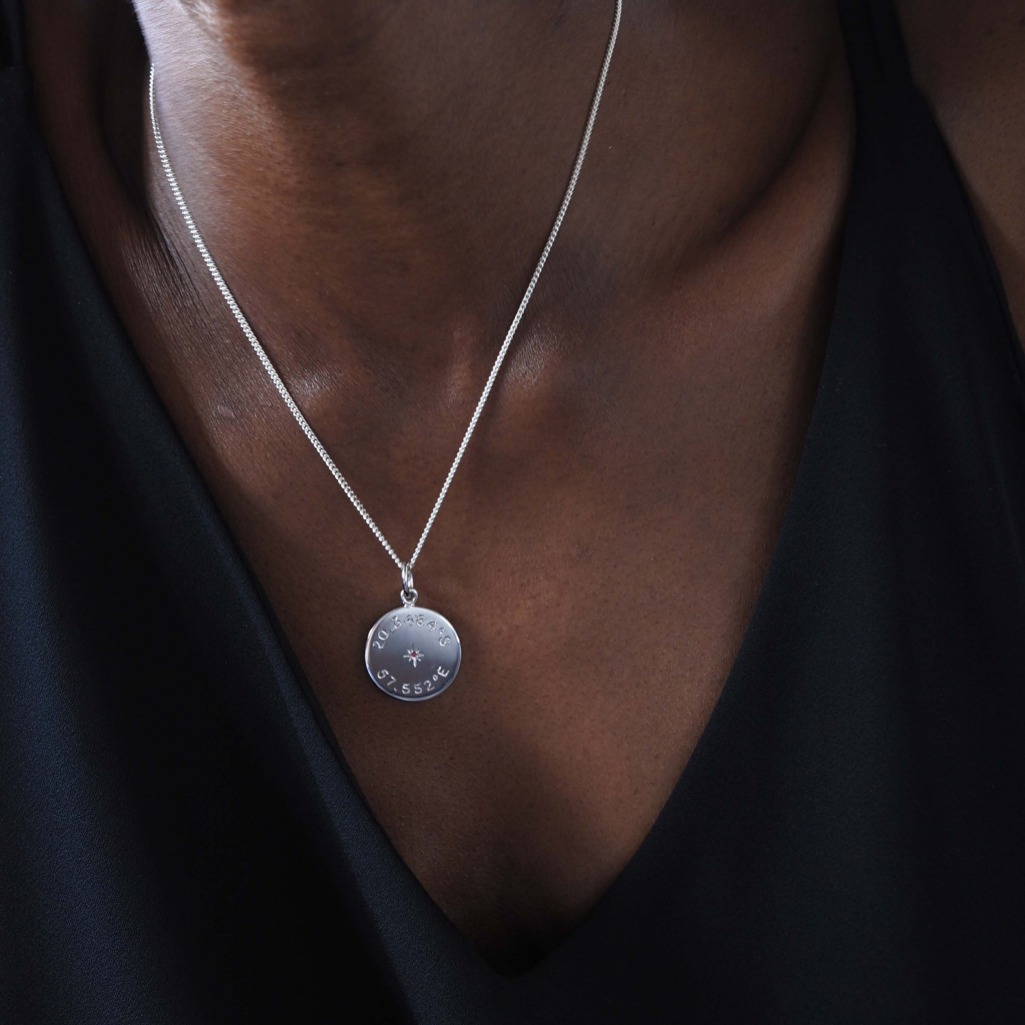 Sterling silver Birthstone Latitude and Longitude Necklace with hand-engraved coordinates and a Victoriana star-set birthstone, symbolising timeless memories and personal connections. Ideal for capturing special moments.