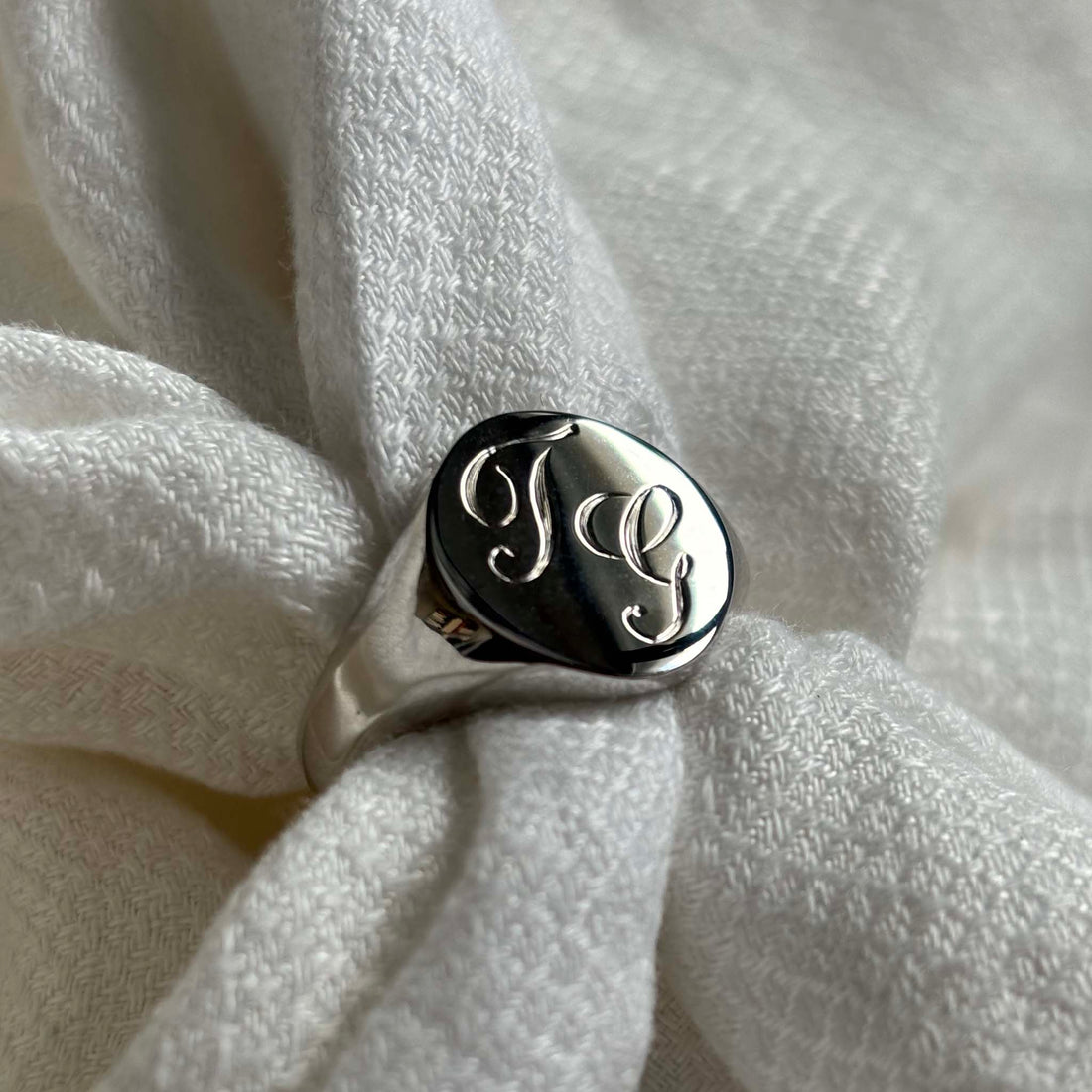 Solid Gold Double Initial Signet Ring with hand-engraved scrolled initials, featuring luxurious curves and a robust, classic form. Ideal for pinky or ring finger adornment.