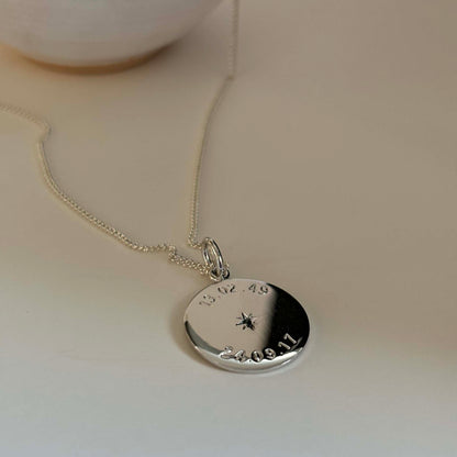 Weighty 1.3mm recycled sterling silver necklace with two engraved dates and star-set birthstones, celebrating meaningful milestones and crafted sustainably.