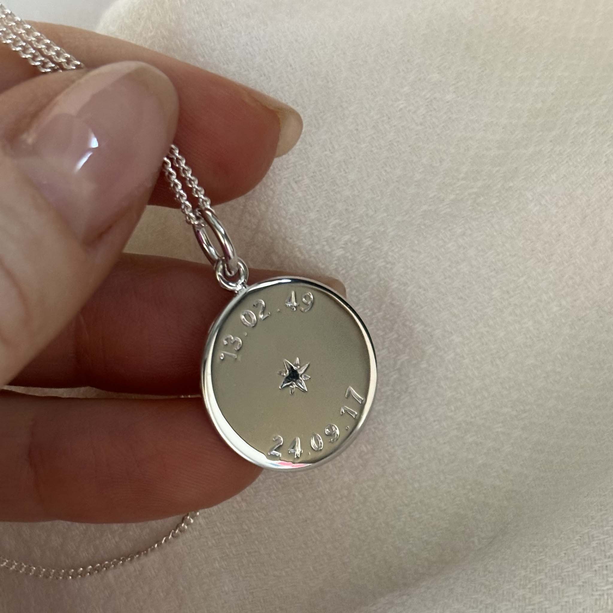 Weighty 1.3mm recycled sterling silver necklace with two engraved dates and star-set birthstones, celebrating meaningful milestones and crafted sustainably.