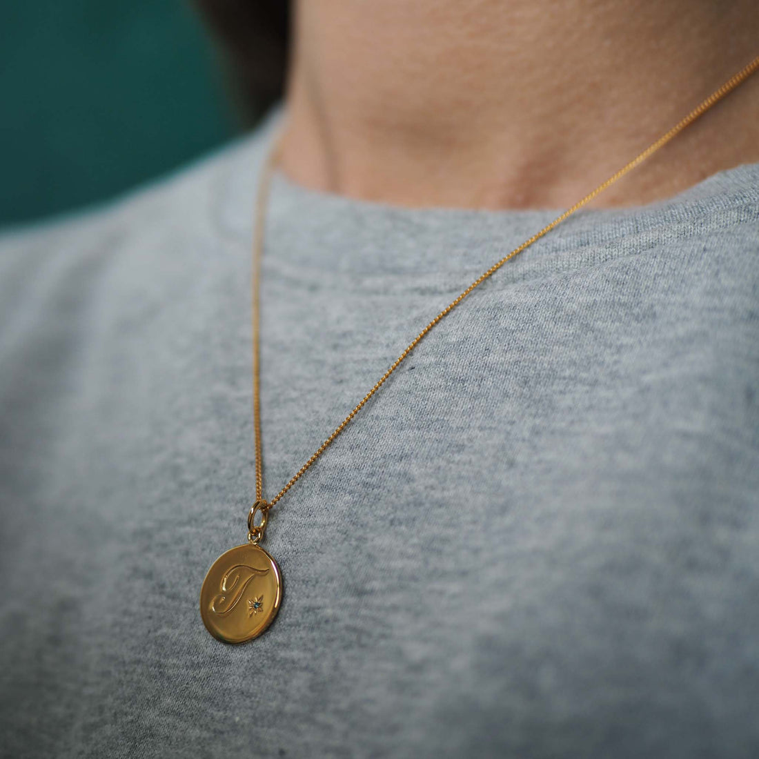 18ct Yellow Gold Vermeil Birthstone December Topaz Initial Necklace featuring a serene Topaz Blue gemstone, symbolising loyalty, love, and timeless elegance, perfect for December birthdays.