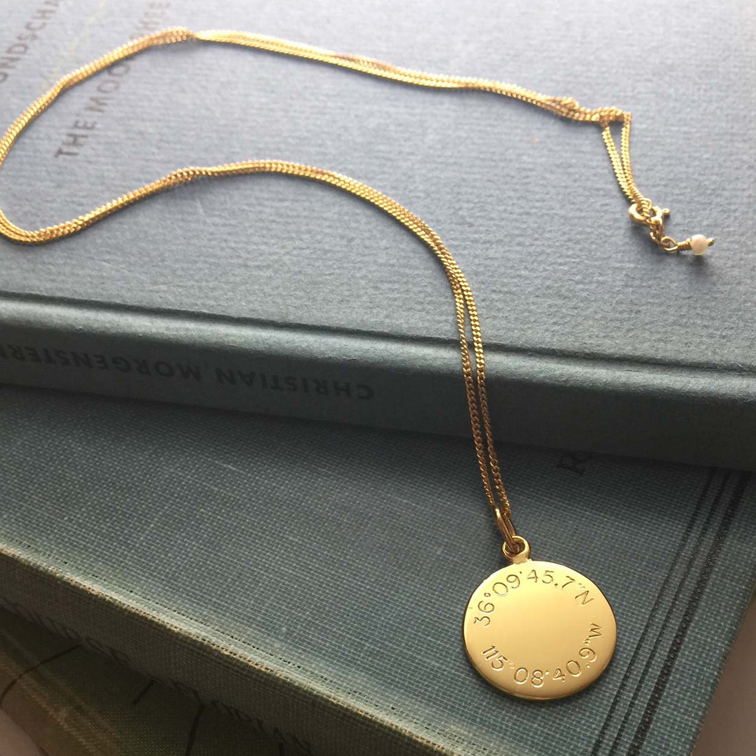 Latitude and Longitude Necklace in Yellow Gold Vermeil, hand-engraved with personalised coordinates. A meaningful keepsake symbolising love and connection.