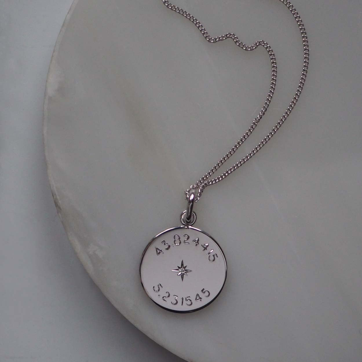 Sterling silver Diamond Latitude and Longitude Necklace with personalized coordinates, symbolizing celestial navigation and cherished memories