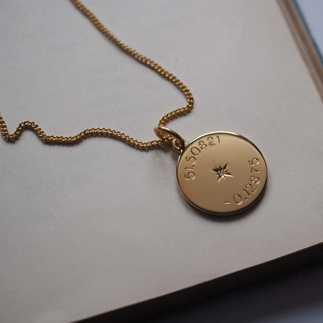 Latitude and Longitude Diamond Necklace in gold vermeil, featuring personalised coordinates, evoking celestial navigation and cherished memories