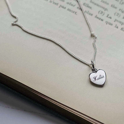 Personalised Name Heart Necklace in 9ct Gold, available in Yellow, White, or Rose. Engraved with a name, this heart-shaped pendant symbolises timeless love and connection.