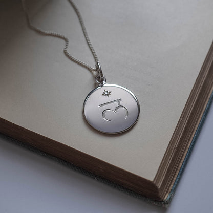 Chakra Necklace in the Chakra Necklace Collection, hand-engraved with one of the seven sacred Chakra symbols and star-set with a brilliant Diamond, symbolising balance, spiritual harmony, and strength.