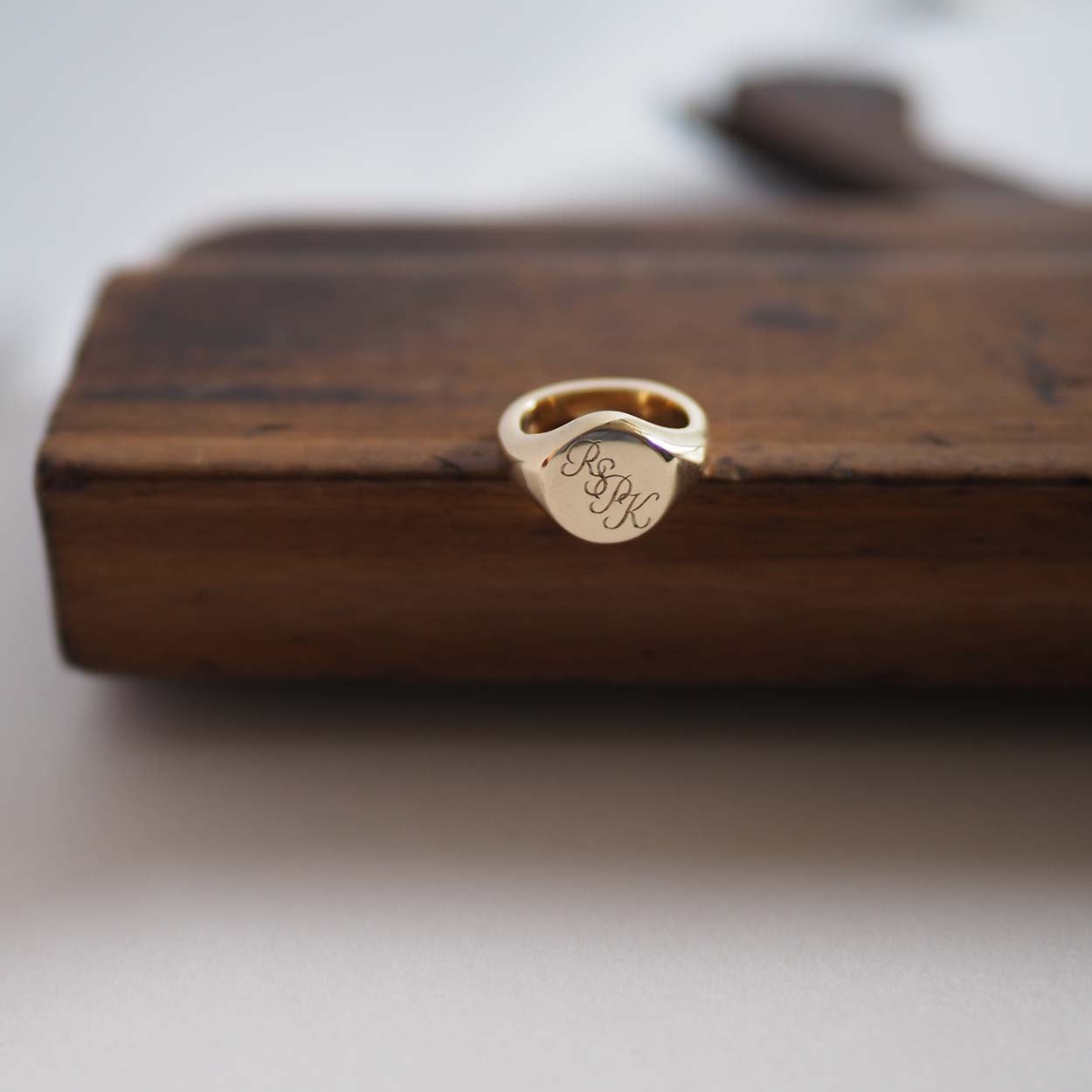  Handmade Triple Initial Signet Ring with intricate scrolled initials, symbolising timeless elegance and individuality