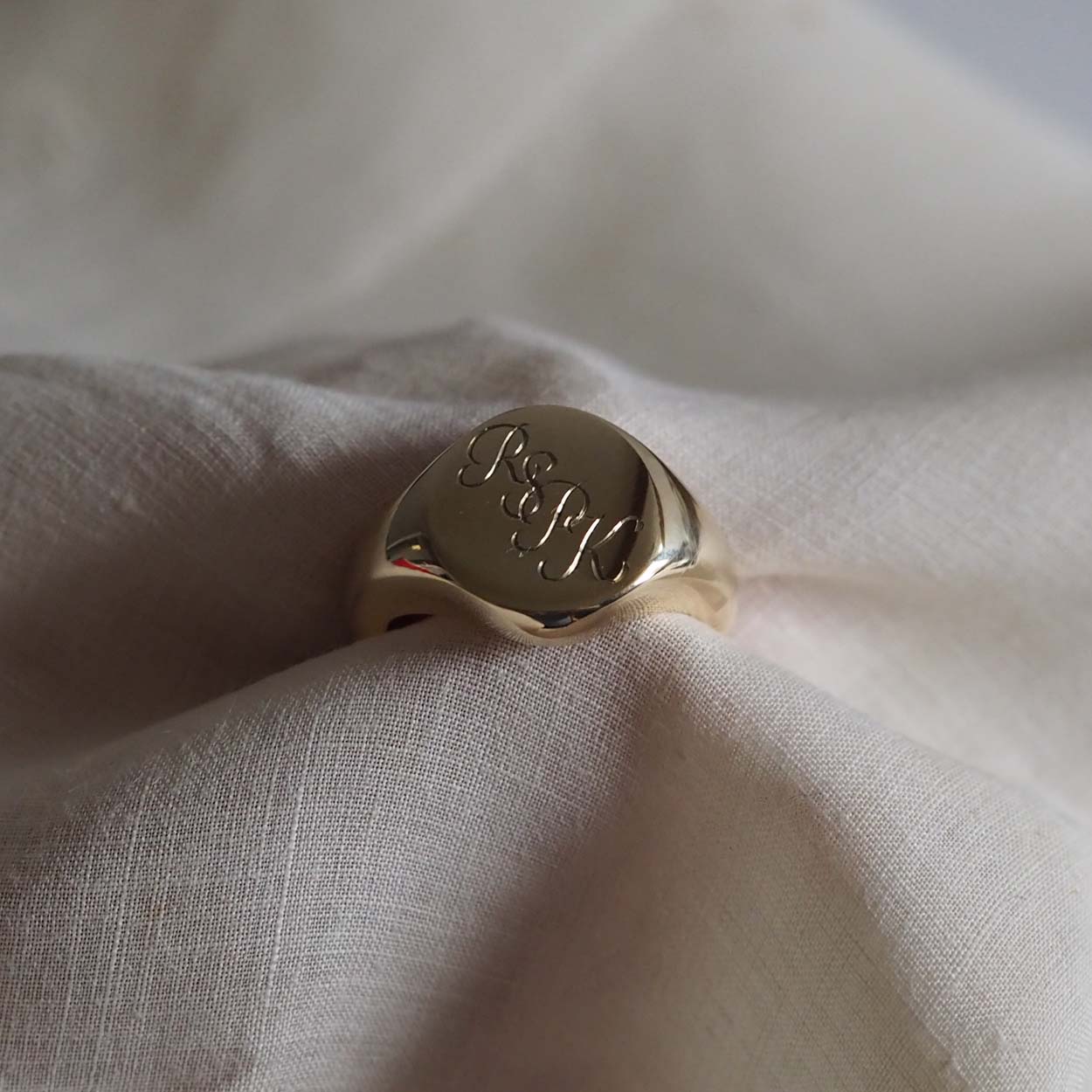  Handmade Triple Initial Signet Ring with intricate scrolled initials, symbolising timeless elegance and individuality