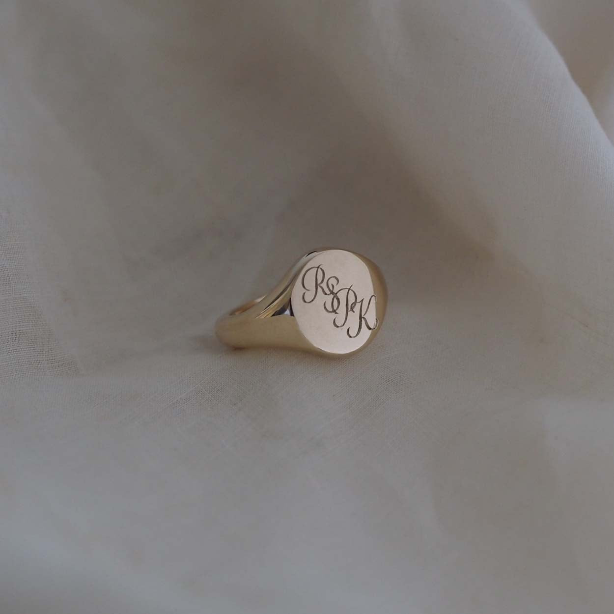  Handmade Triple Initial Signet Ring with intricate scrolled initials, symbolising timeless elegance and individuality