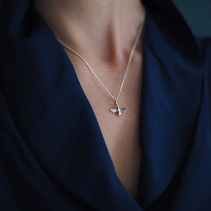 Model wearing 18ct white gold bee necklace on 18-inch chain