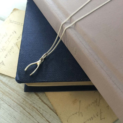 Handcrafted 9ct gold wishbone pendant necklace side angle