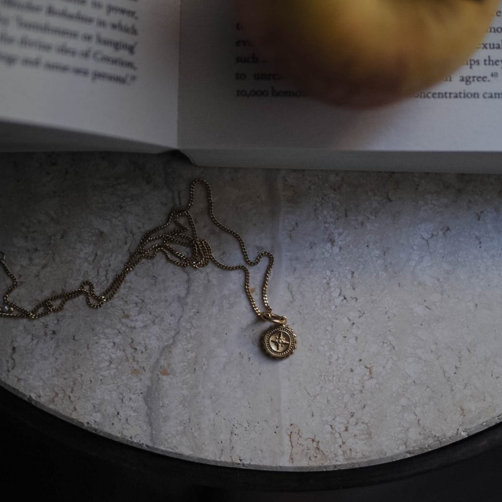 Bianca Jones compass baby necklace available in sterling silver or gold vermeil, symbolising guidance and adventure for explorers.