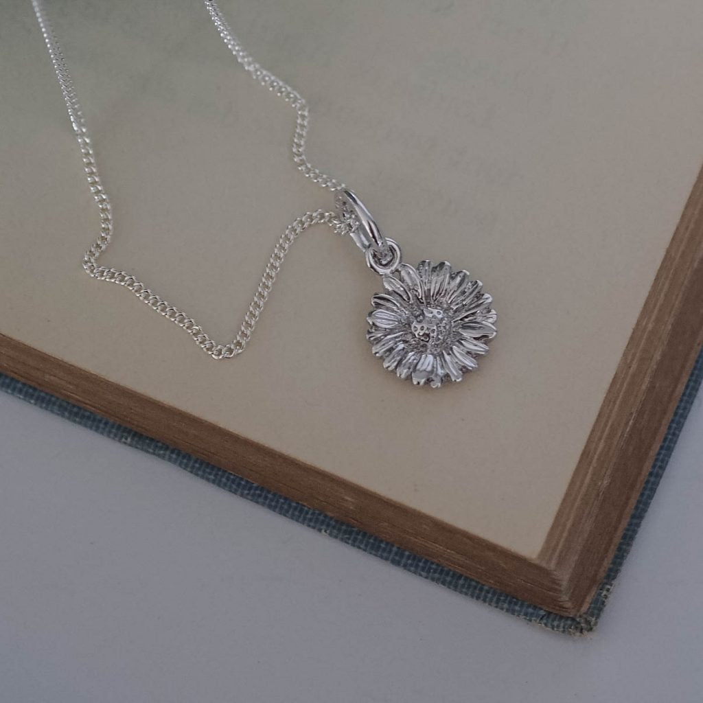 Bianca Jones daisy necklace available in silver or gold vermeil, symbolising innocence and new beginnings