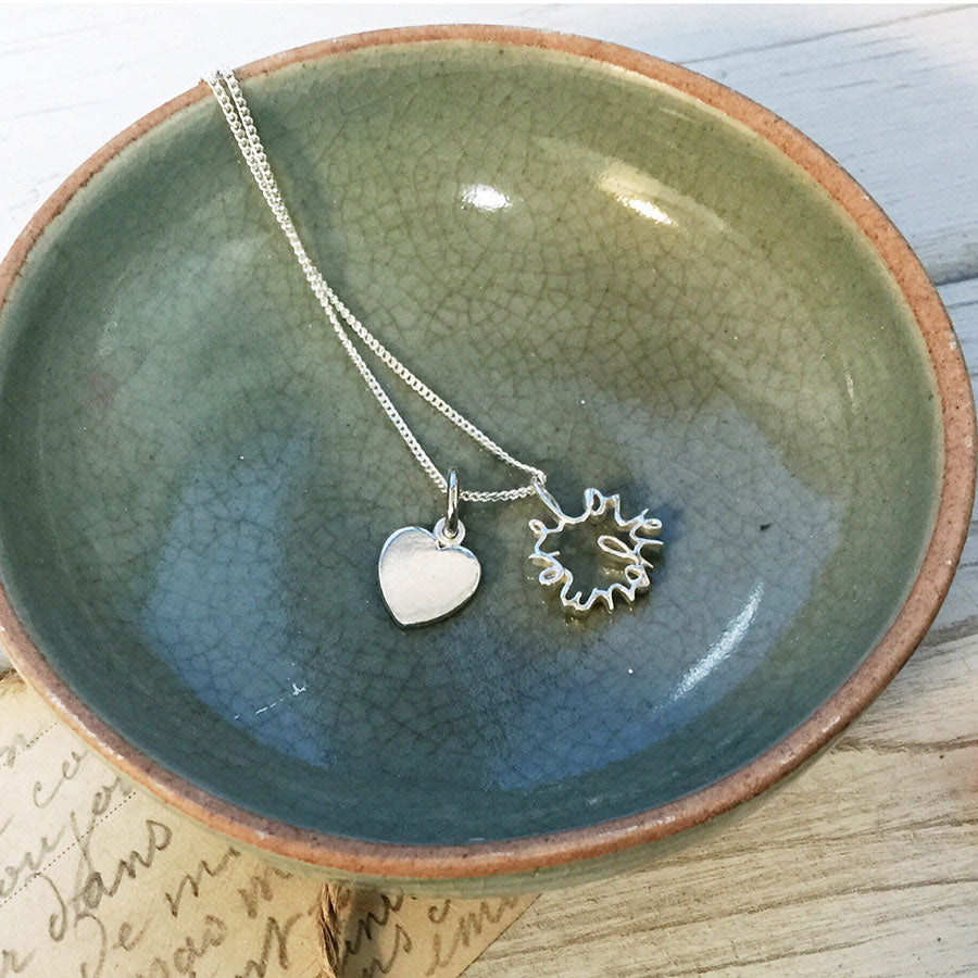 Solid gold Love You More Heart Necklace with double charm design, handcrafted in London — symbolic jewellery gift for someone special.