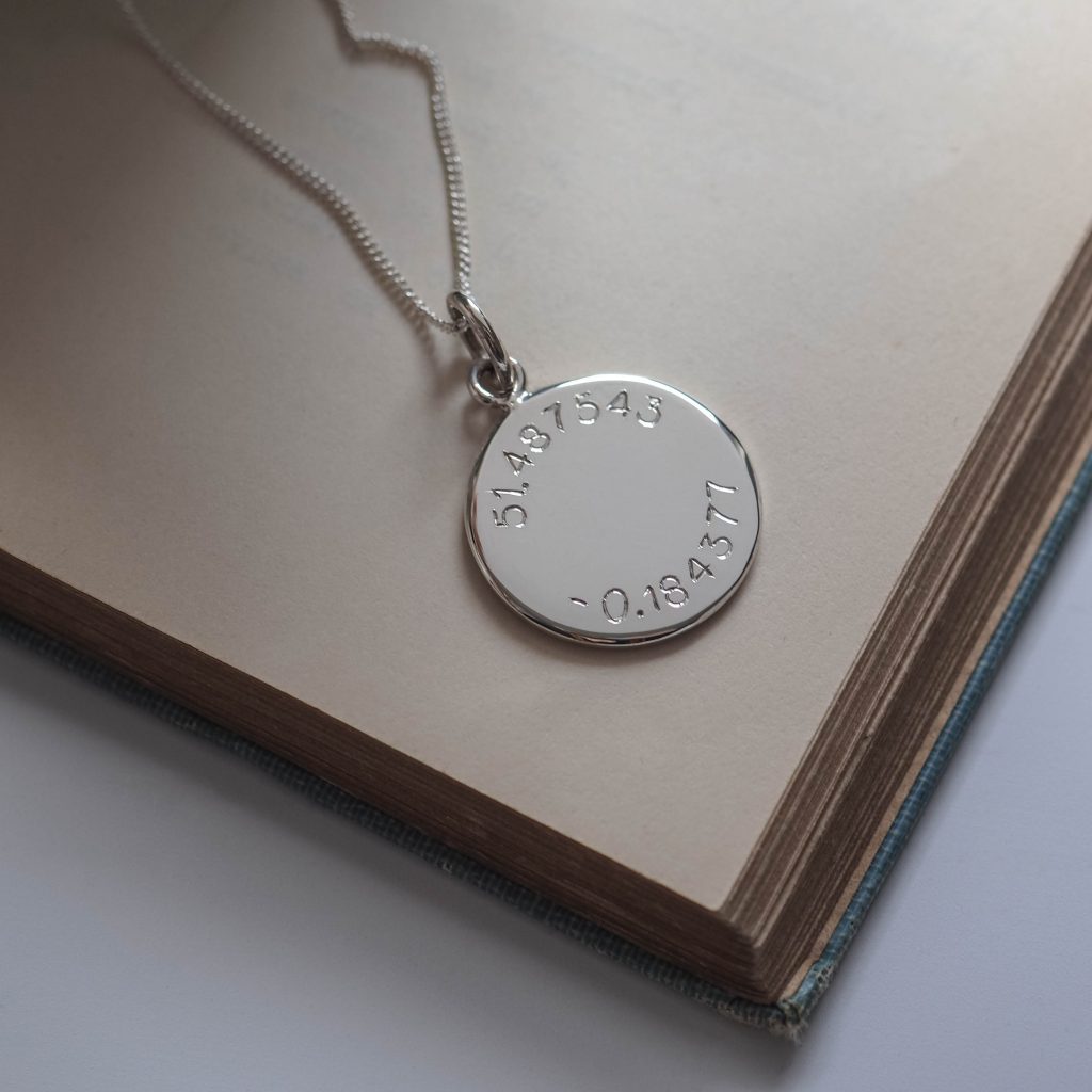 Latitude and Longitude Necklace in Sterling Silver, featuring hand-engraved coordinates. A personalised keepsake inspired by ancient celestial navigation.