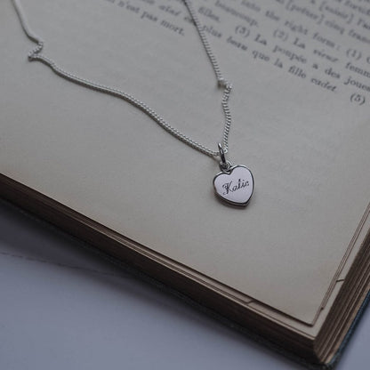 Personalised Name Heart Necklace in 9ct Gold, available in Yellow, White, or Rose. Engraved with a name, this heart-shaped pendant symbolises timeless love and connection.