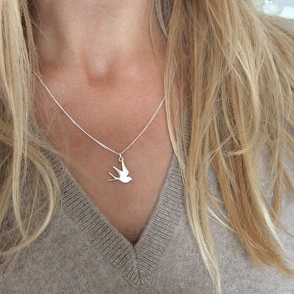 Bianca Jones flat, highly polished swallow necklace in sterling silver or gold vermeil, symbolising freedom and hope