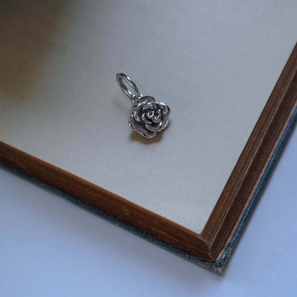 Handmade solid rose charm available in white, yellow, and rose gold, showcasing exquisite craftsmanship and detail