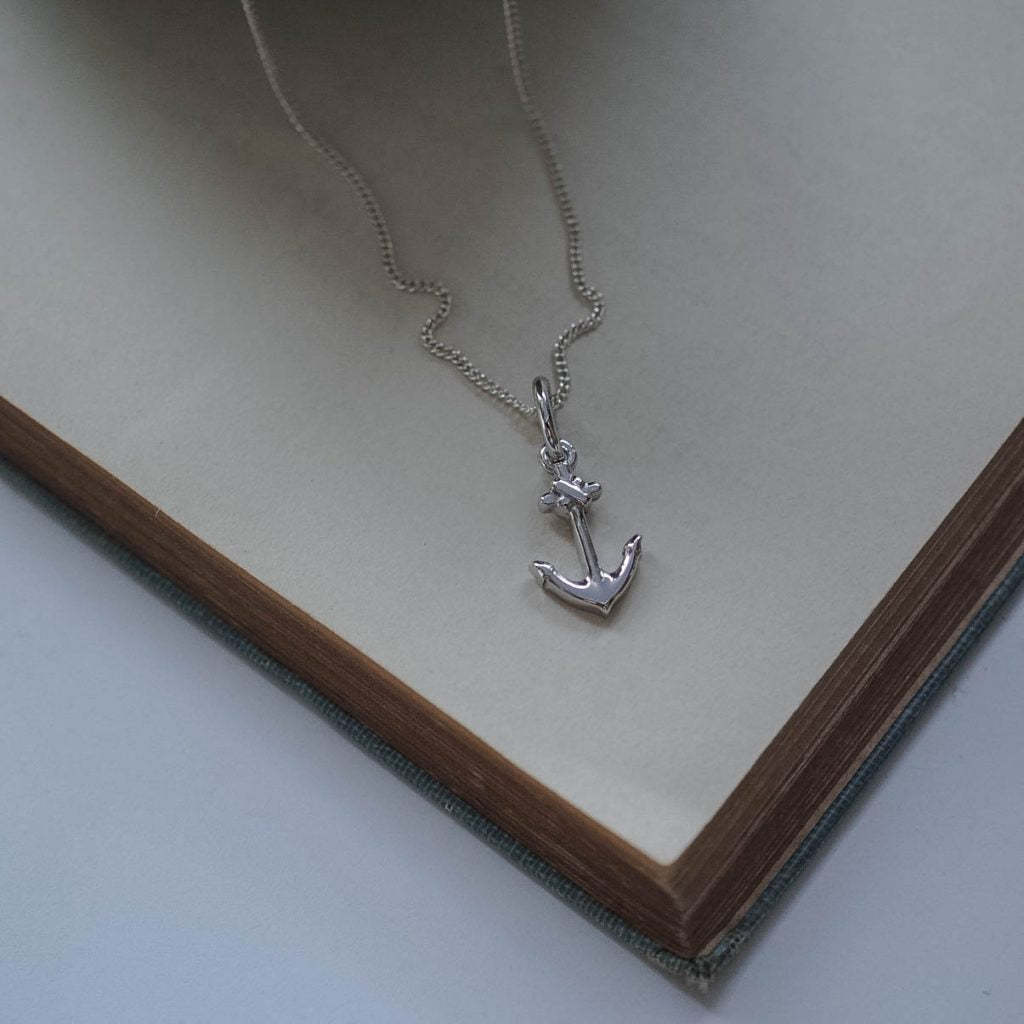 Silver anchor necklace symbolising strength and hope, handmade in London.