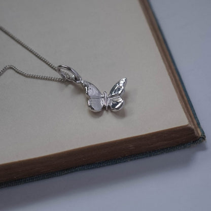 Solid gold Butterfly Necklace photographed as a meaningful gift and timeless everyday heirloom
