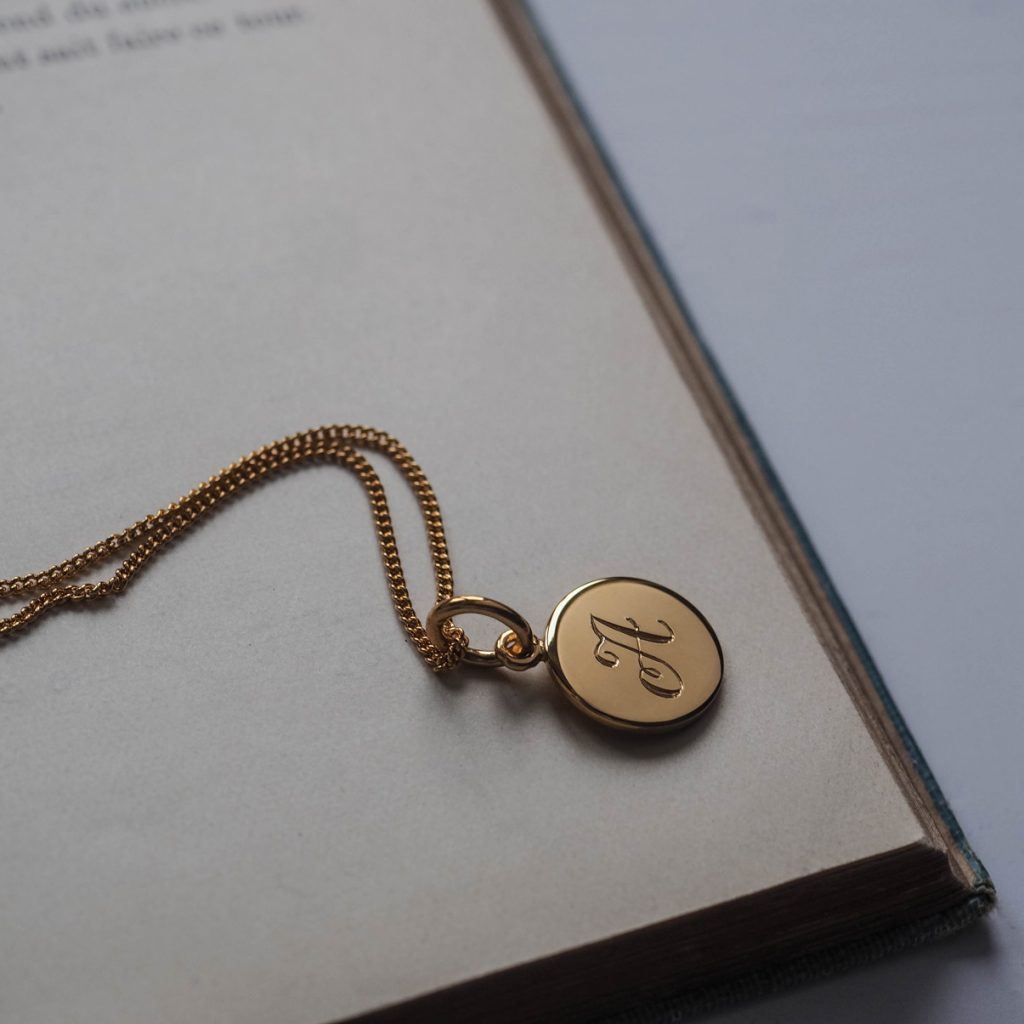 Initial Mini Necklace with a hand-engraved scrolled initial, perfect for layering or wearing alone. A personalised piece symbolising love and connection.