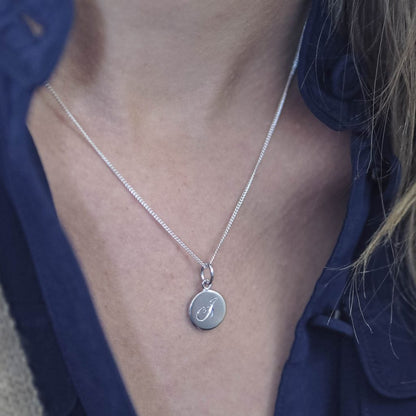 Initial Mini Necklace with a hand-engraved scrolled initial, perfect for layering or wearing alone. A personalised piece symbolising love and connection.